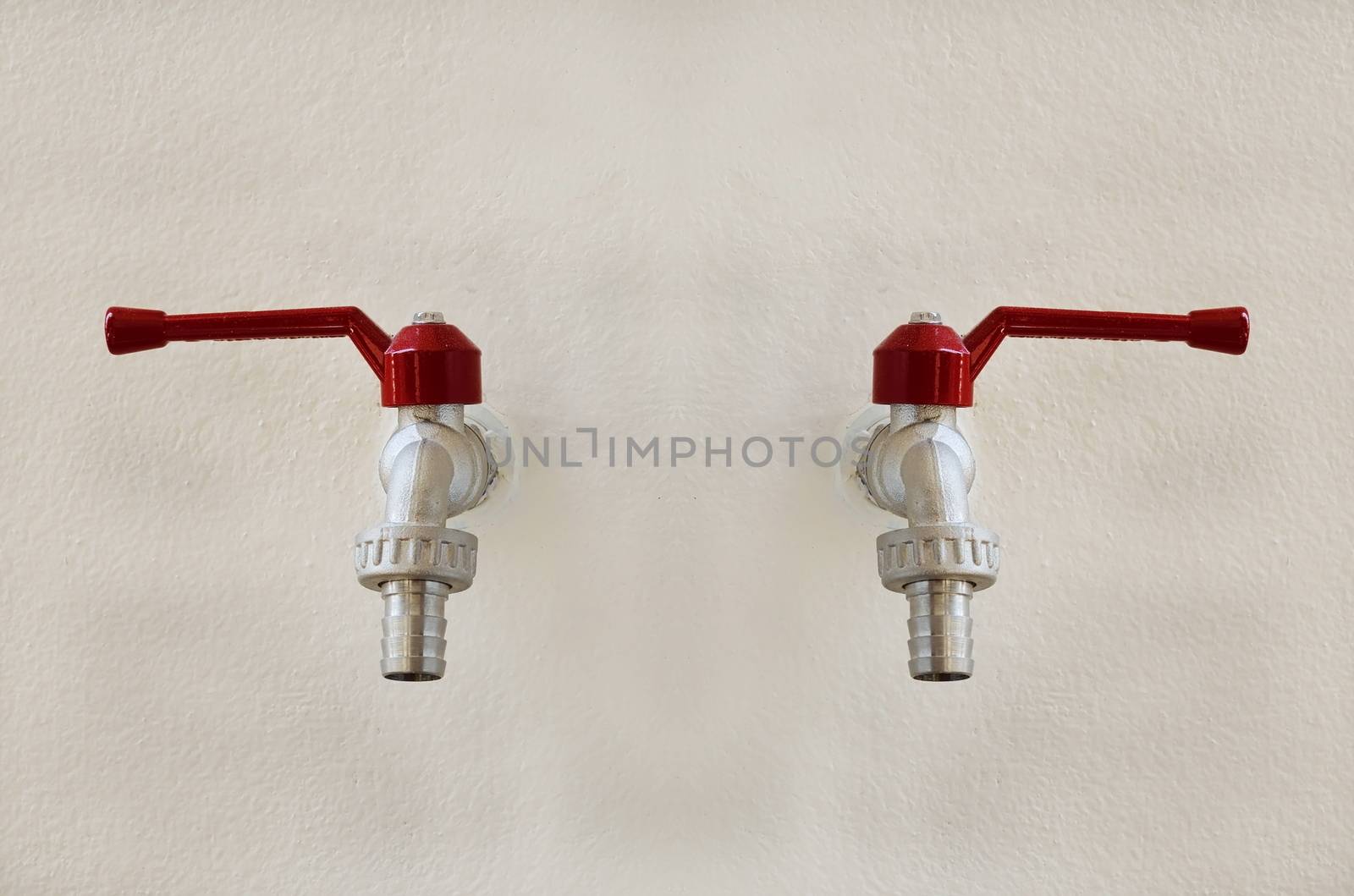 faucets valve on concrete old wall background