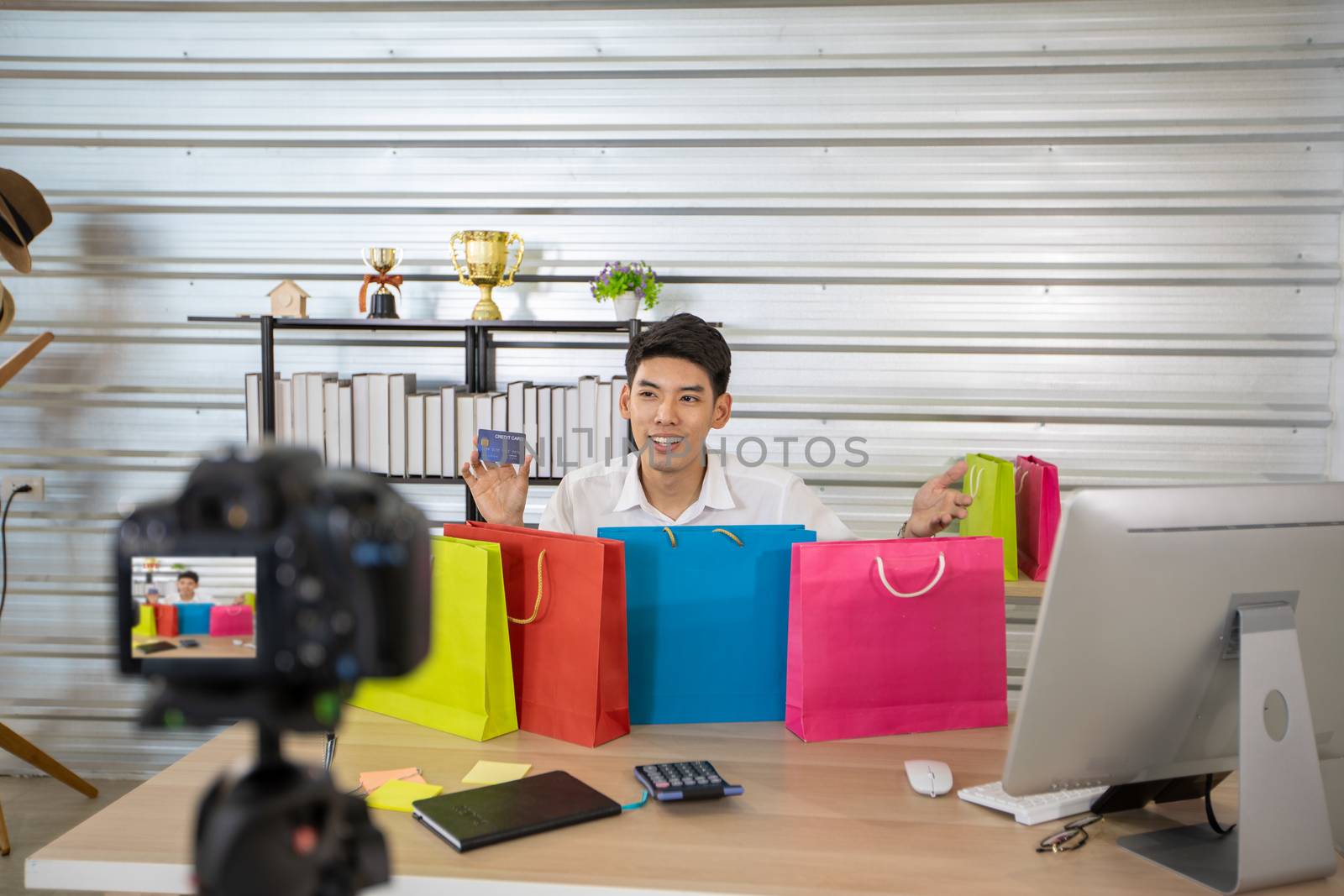 Asian man  blogger broadcasting a video for selling product online .Shopping online concept