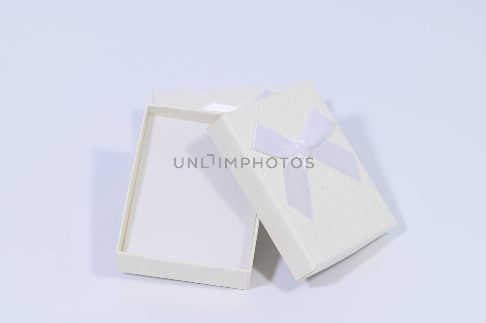 Creamy white gift box In the white background