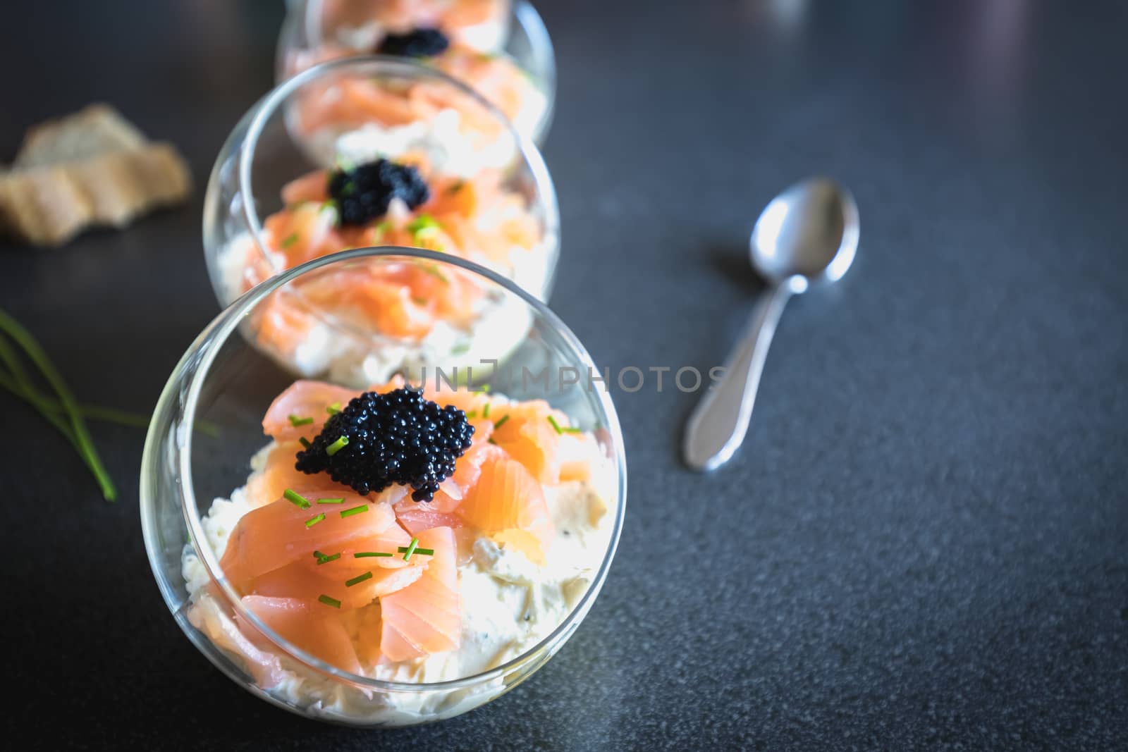 verrine salmon lumpfish egg fresh cheese and avocado bed in the kitchen