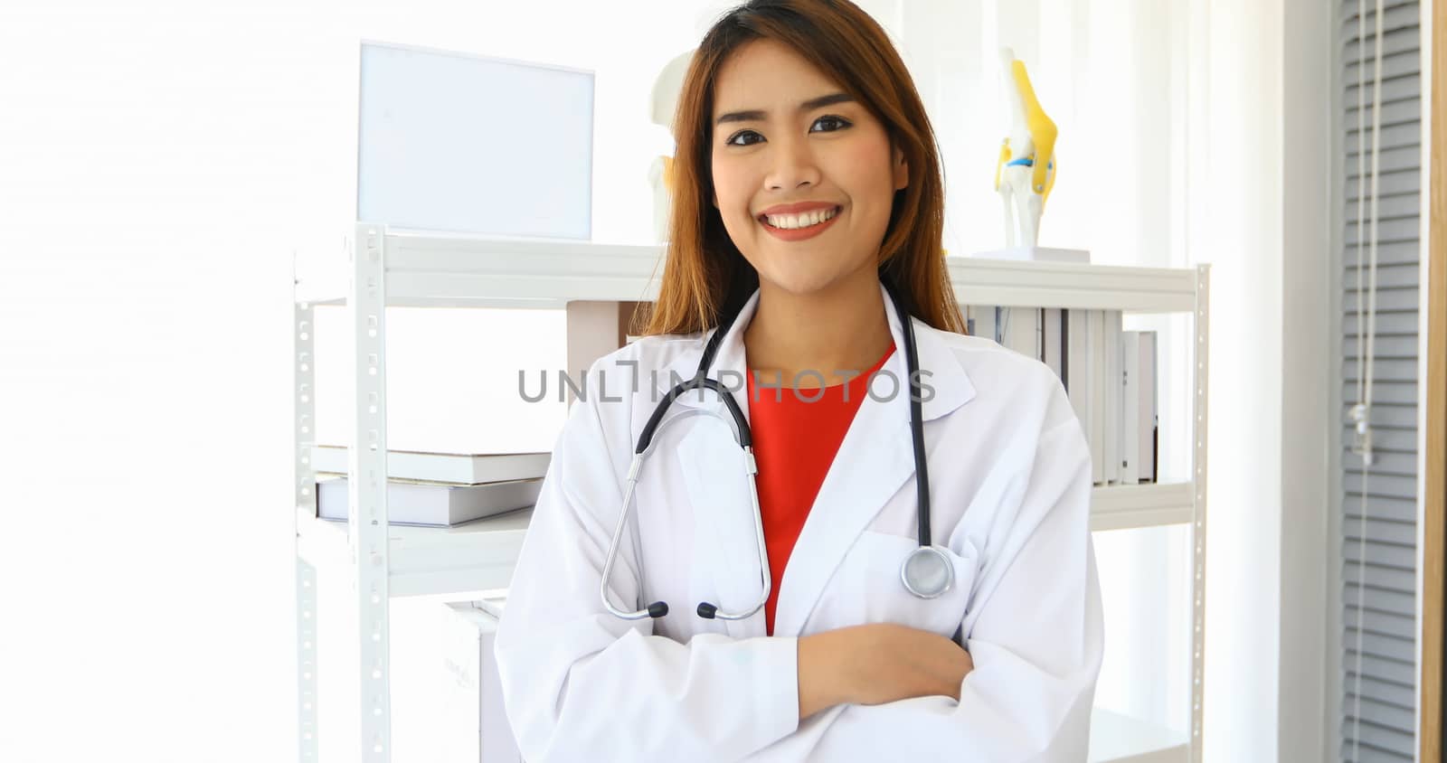 Smiling happy doctor in office