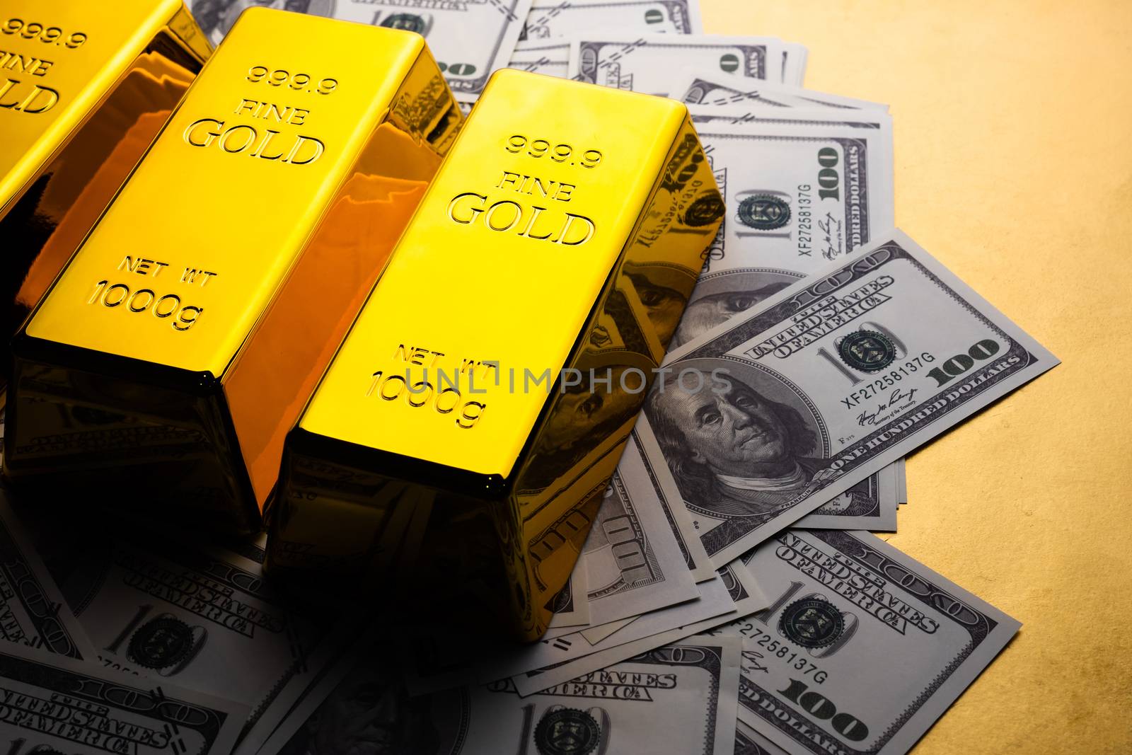 Close up of Gold bars and banknotes. financial concept by ronnarong