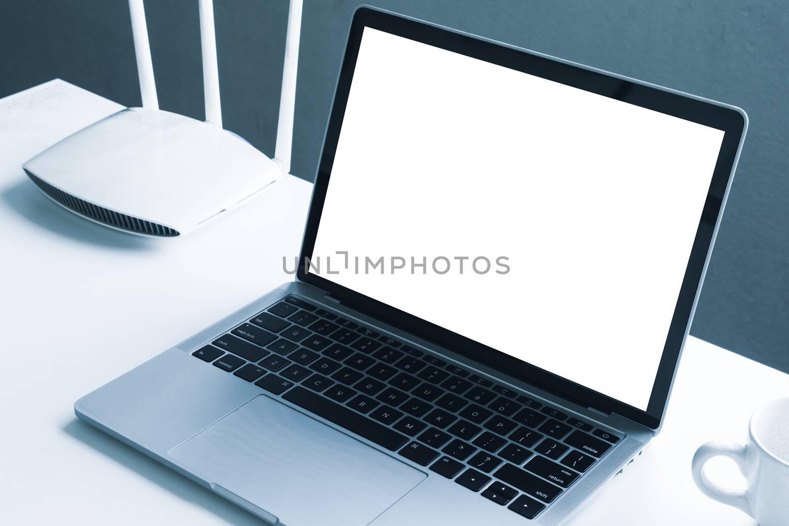 Blank screen laptop computer and router device on the table by ronnarong