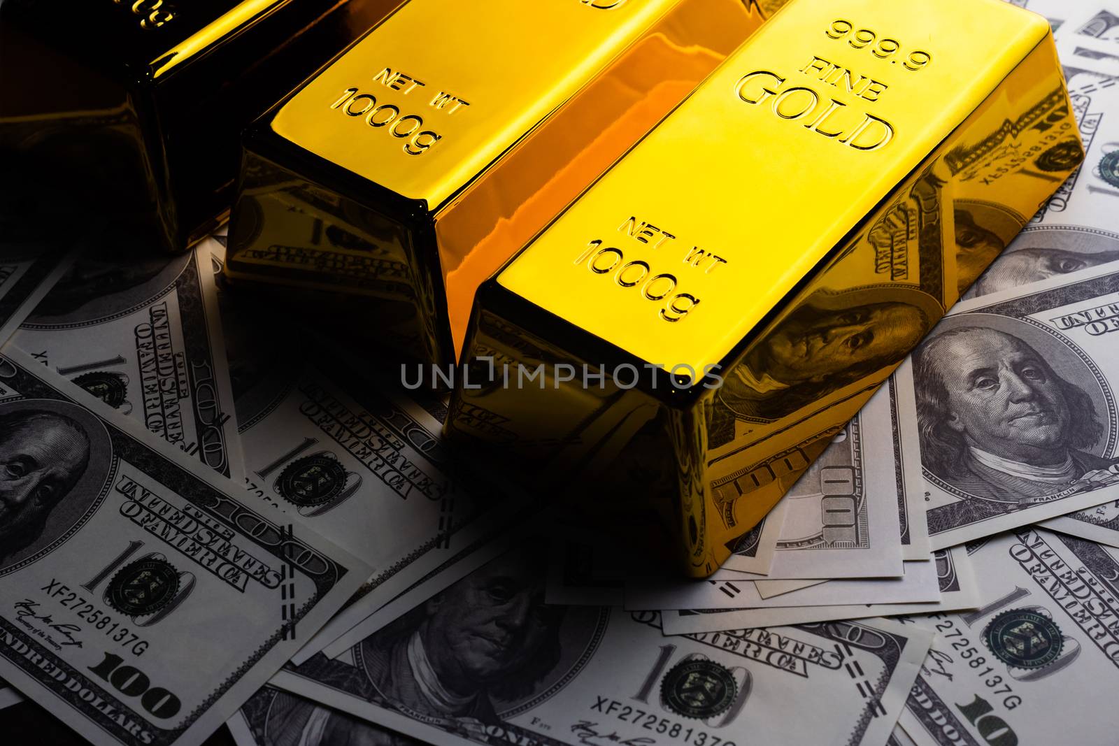 Close up of Gold bars and banknotes. financial concept