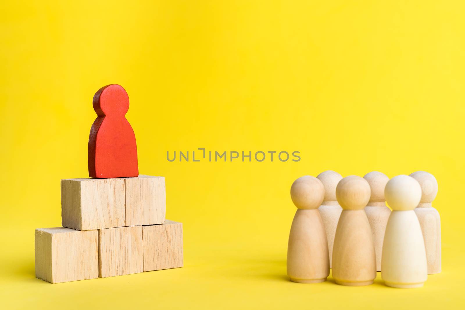 Group of wood figure Stand in rows and leader stand on the higher in human resource management concepts Teamwork Success Leadership Business Progress, Competition on yellow backgrond and copy space