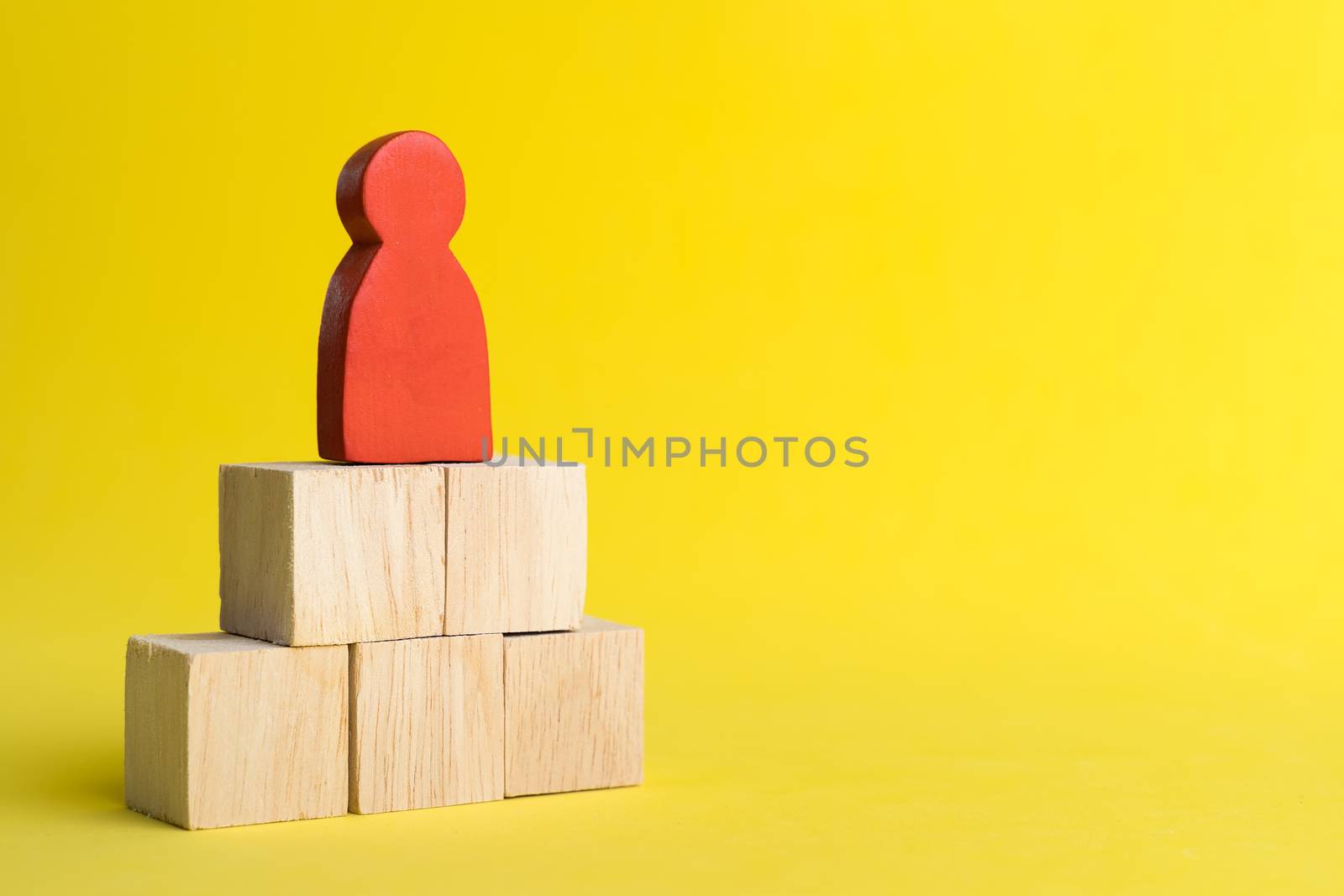 Red wood figure Stand on wood stack in human resource management by Boophuket