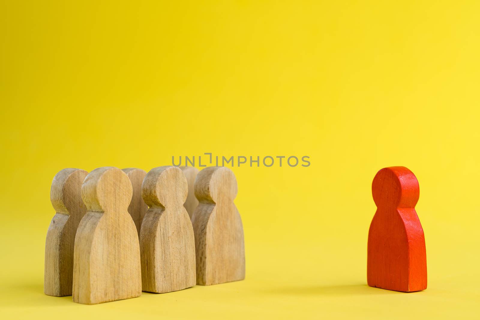 Group of wood figure Stand in rows and leaders standing forward in human resource management concepts Teamwork.Success Leadership, Business Progress and Competition on yellow backgrond and copy space