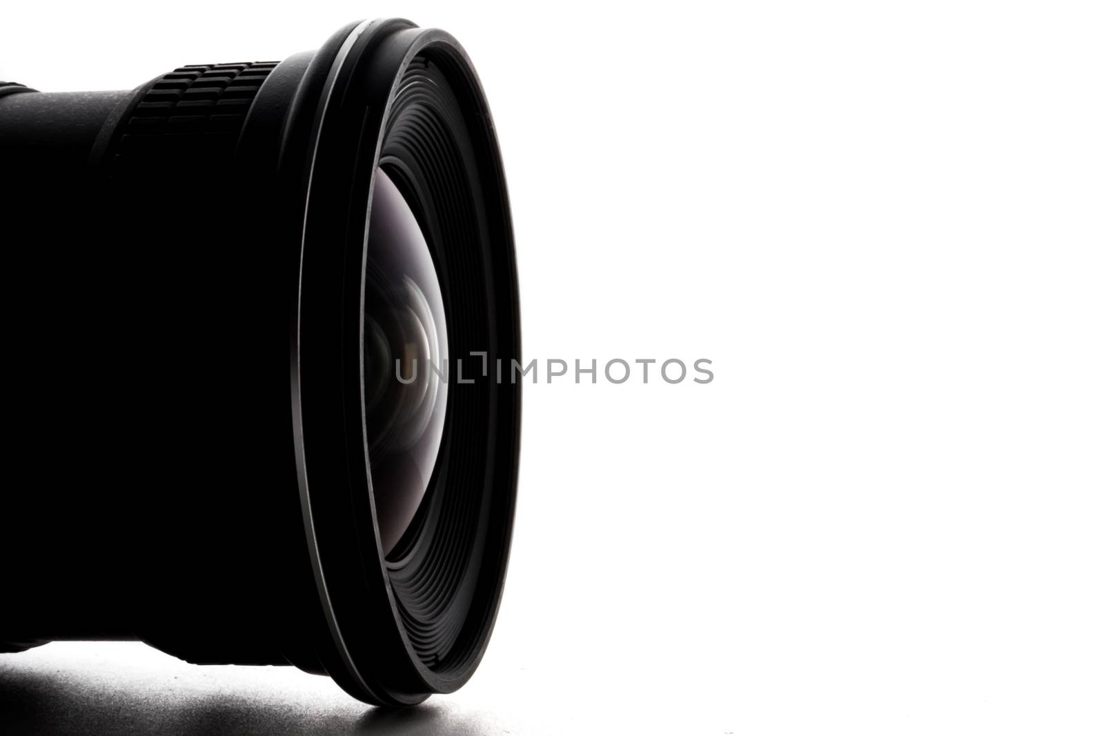 Close up of camera lens with a white background.