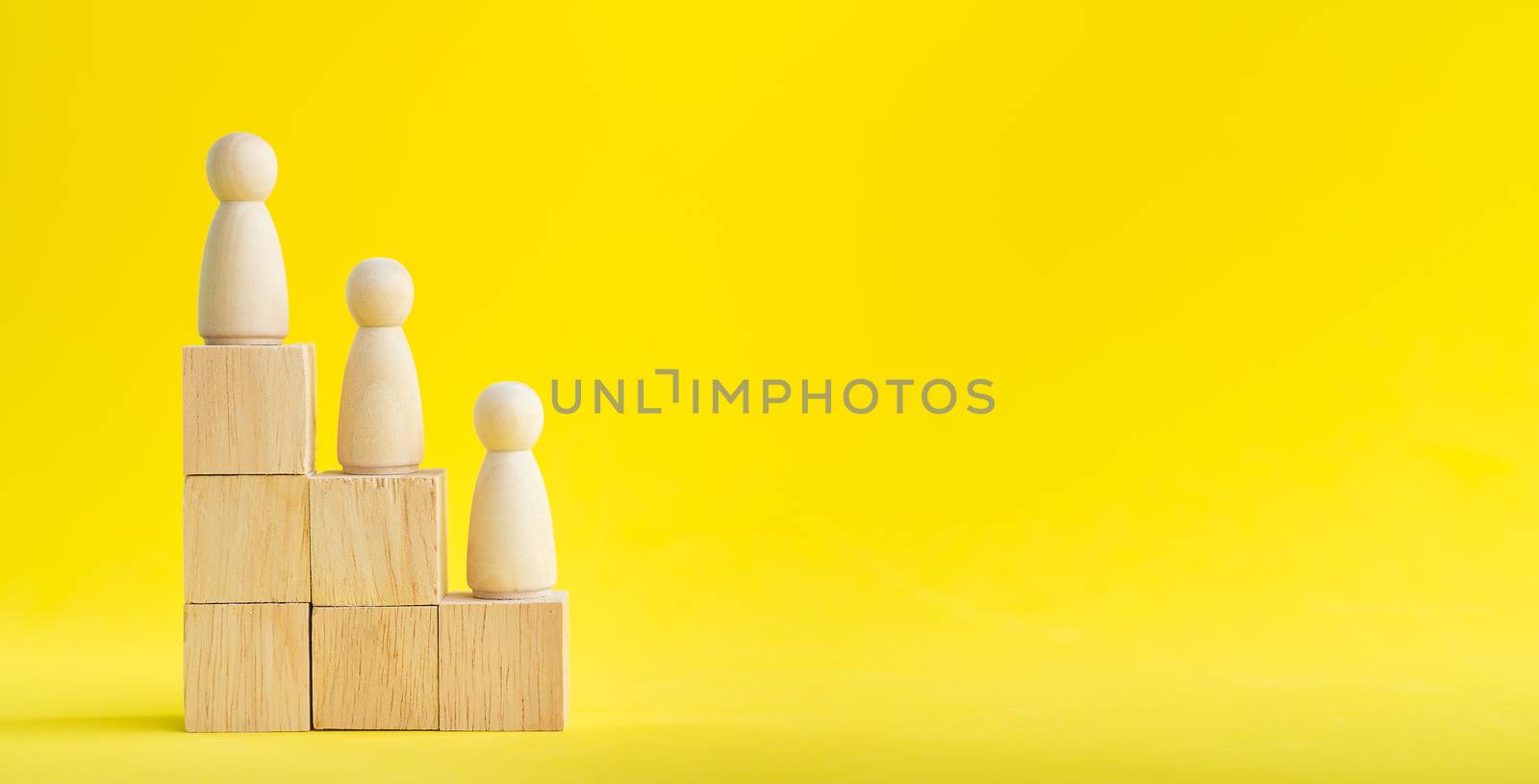 Banner Group of wood figure Standing in the hierarchy on wood stack in human resource management concepts Teamwork Success Leadership Business Progress, Competition on yellow backgrond and copy space
