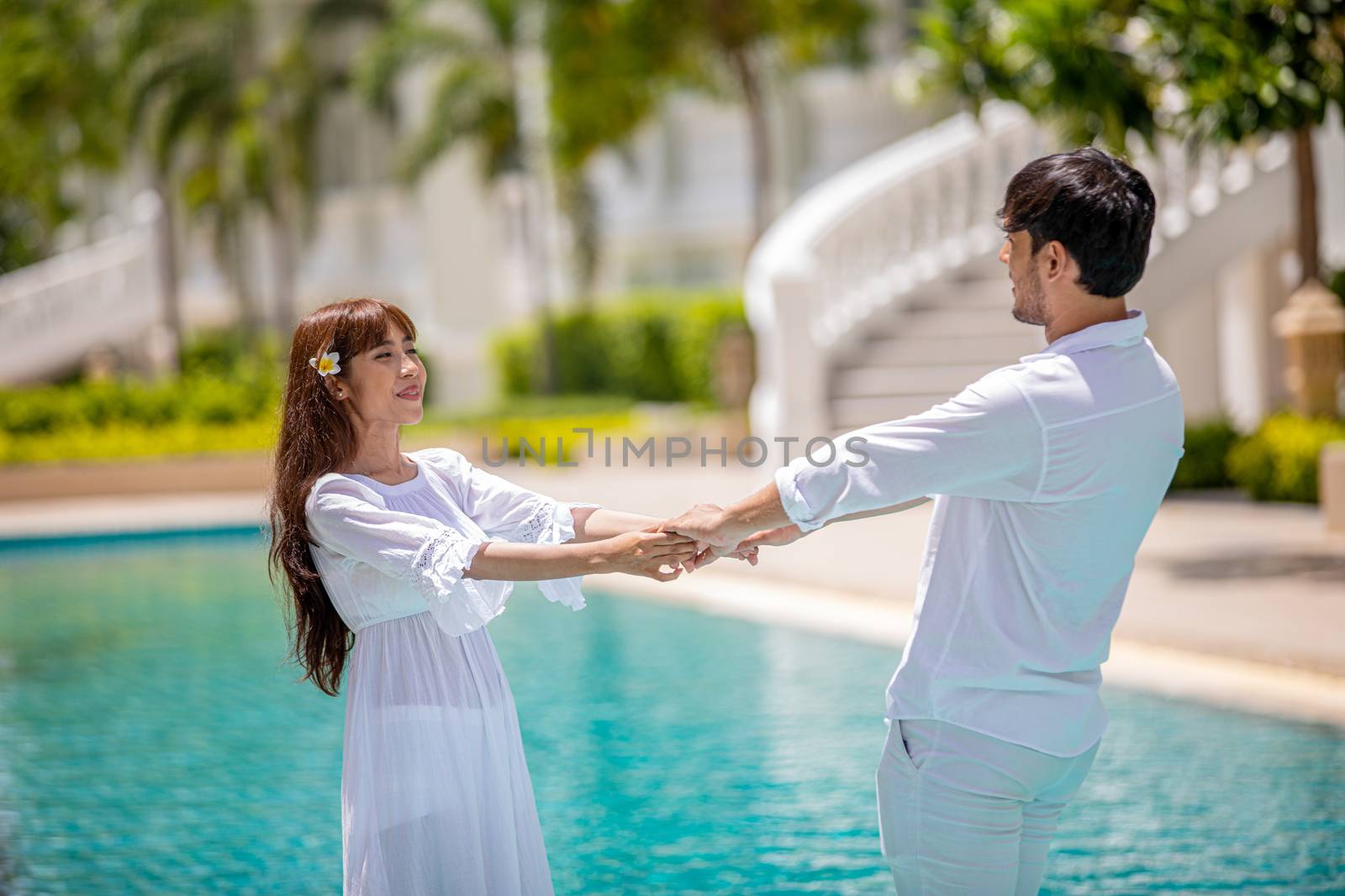 Happy Romantic Couples lover talking and drinking wine while having a picnic