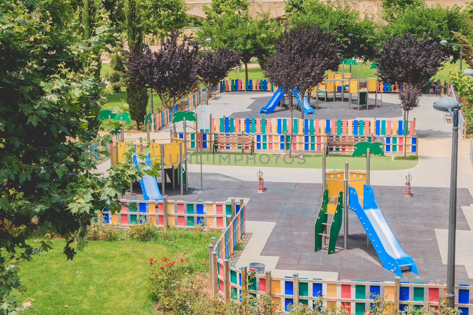 view of a children s park with its games and slides in Valencia by AtlanticEUROSTOXX