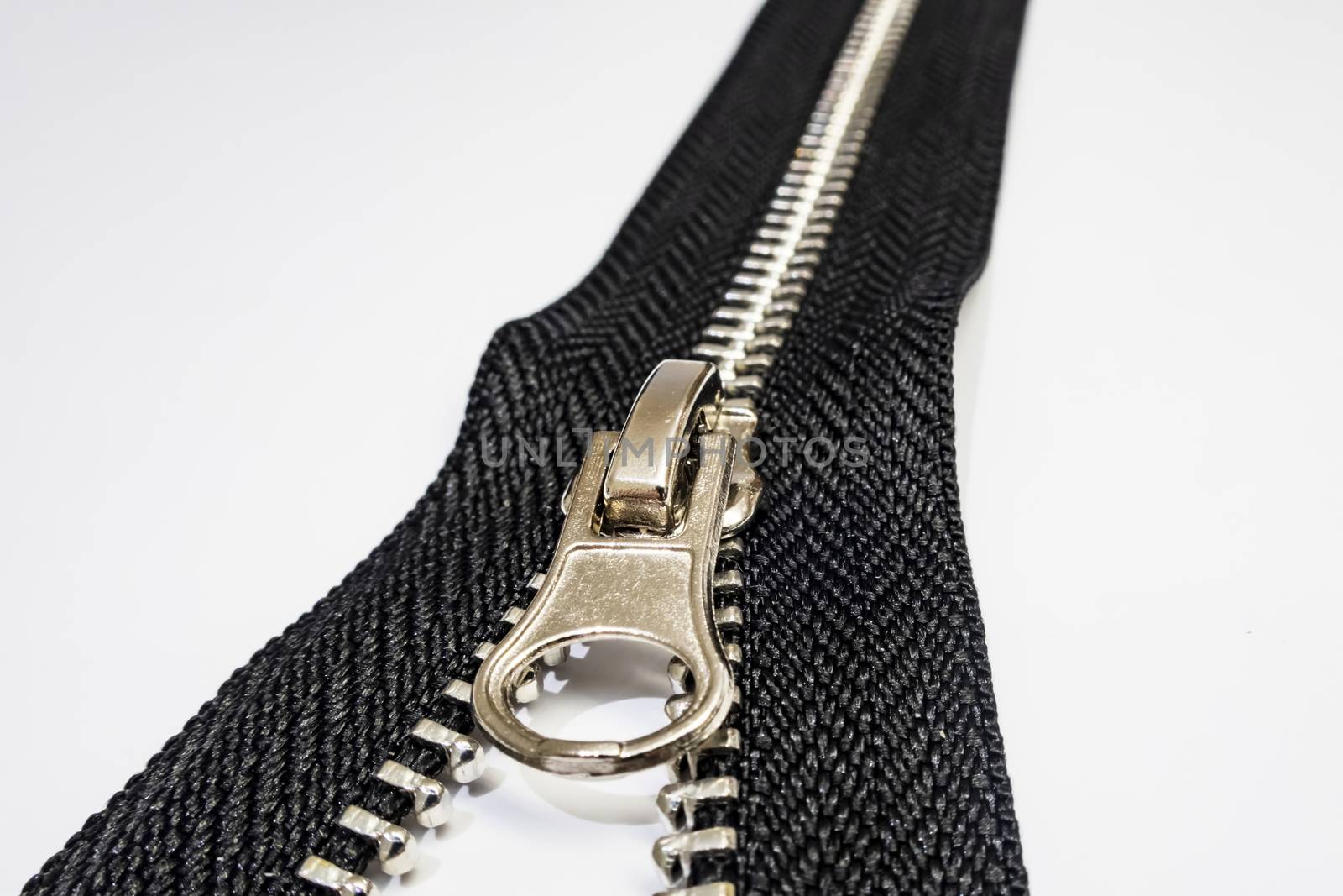 zipper on white background by yilmazsavaskandag