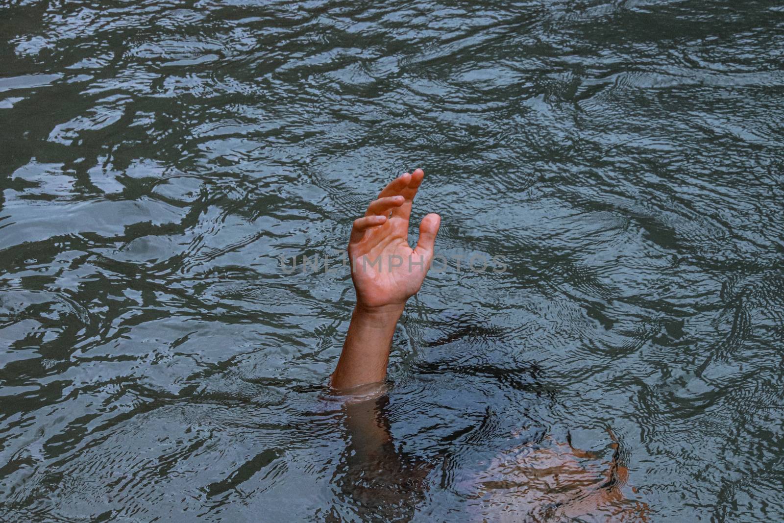 A hand reaching out from under the water by Sonnet15