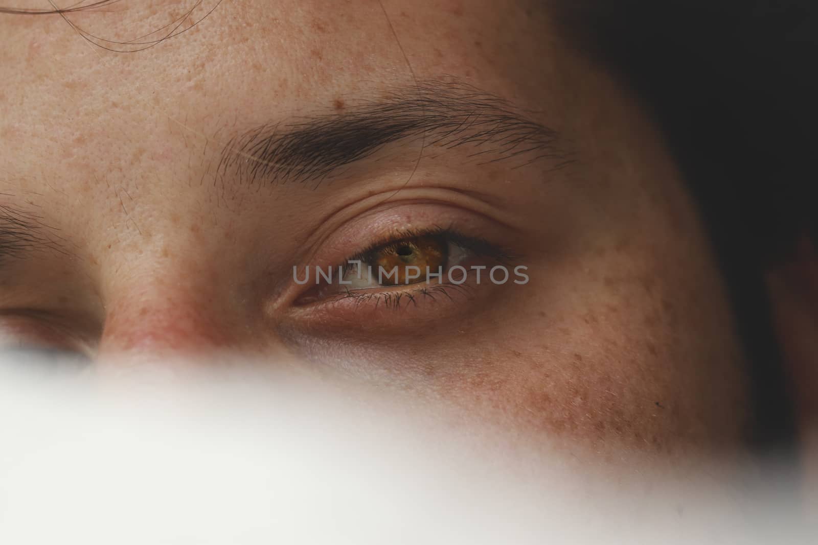 Conceptual portrait of a man hidden in a veil to show concept of male vulnerability, intimacy, gender identity, secrecy and mental health