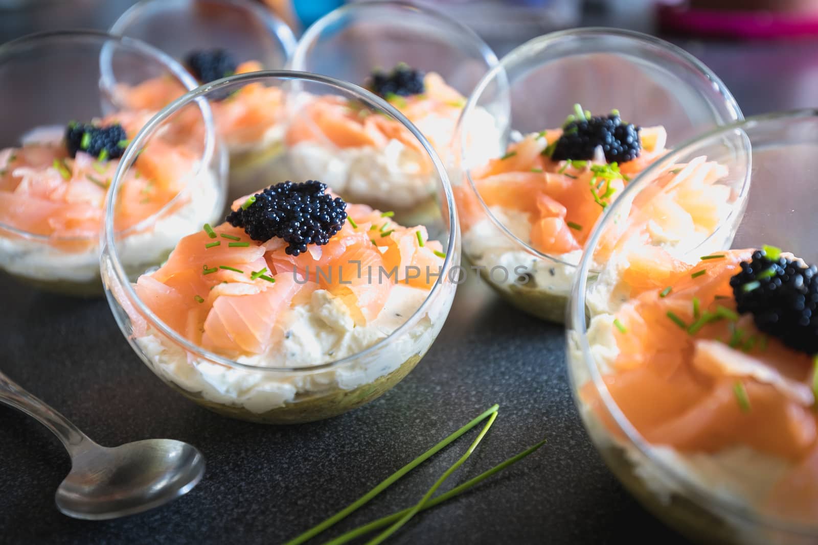 verrine salmon lumpfish egg fresh cheese and avocado bed in the kitchen