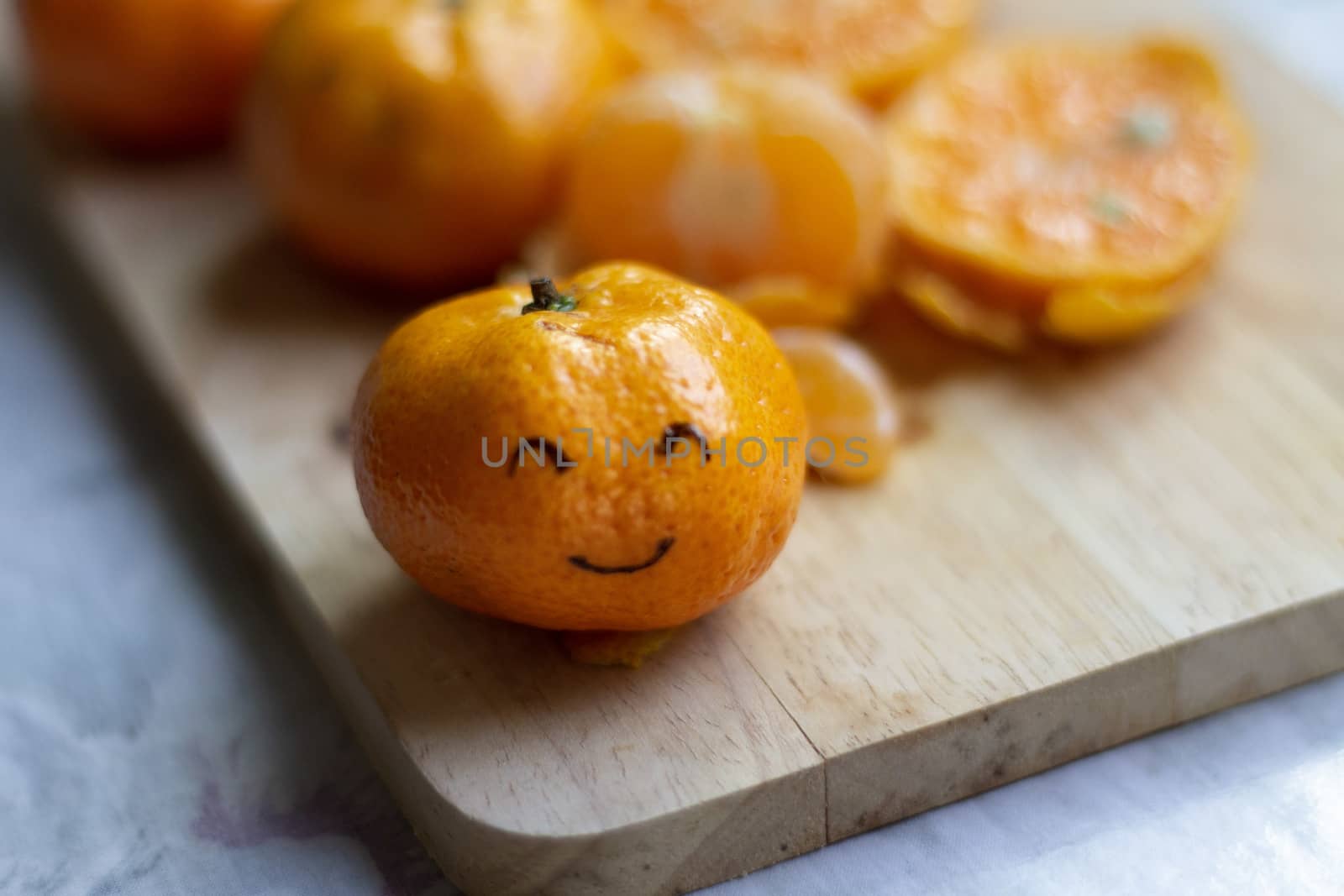 Smiley Face on a Clementine Orange by Sonnet15