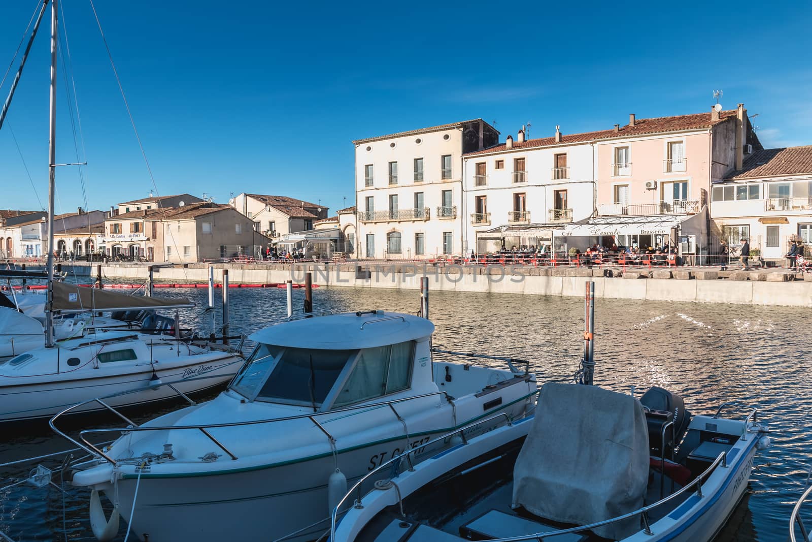 Marseillan, France - December 30, 2018: Pleasure boat docked in the small port of Marseillan on a winter day