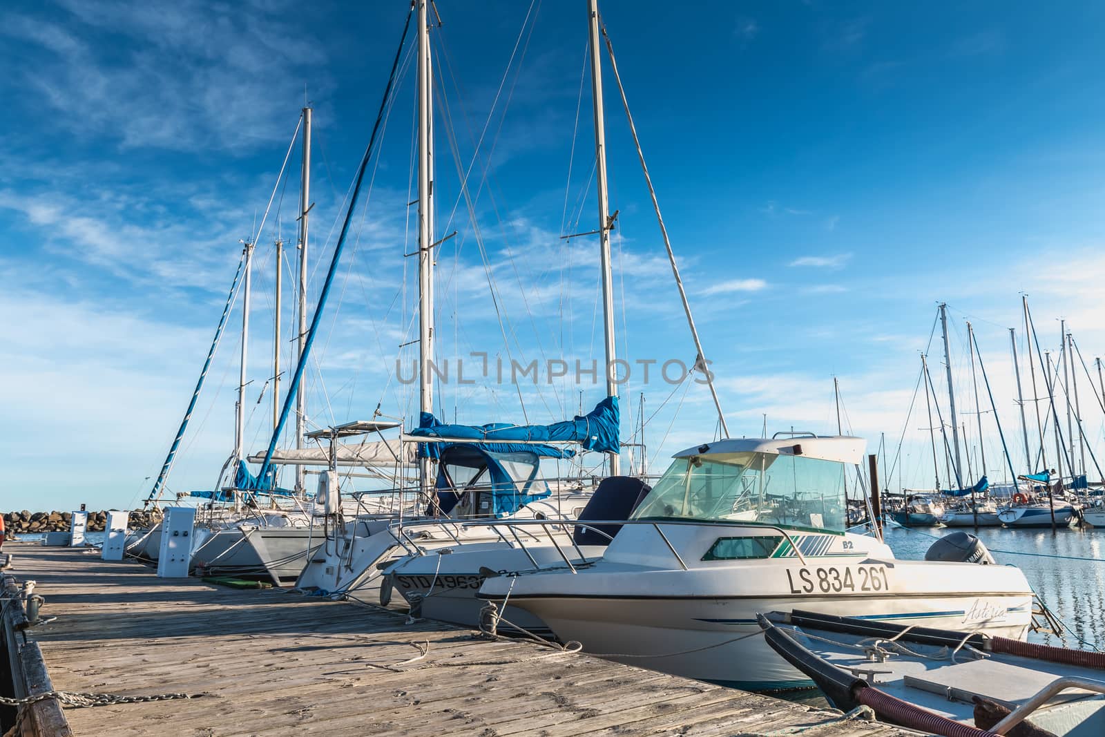 Marseillan, France - December 30, 2018: Pleasure boat docked in the small port of Marseillan on a winter day