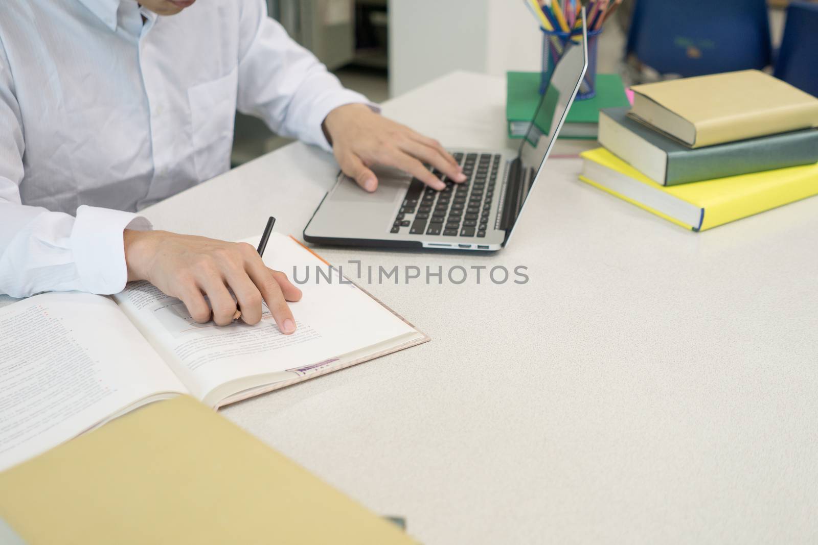 Student making research on laptop and browse internet. Education concept.