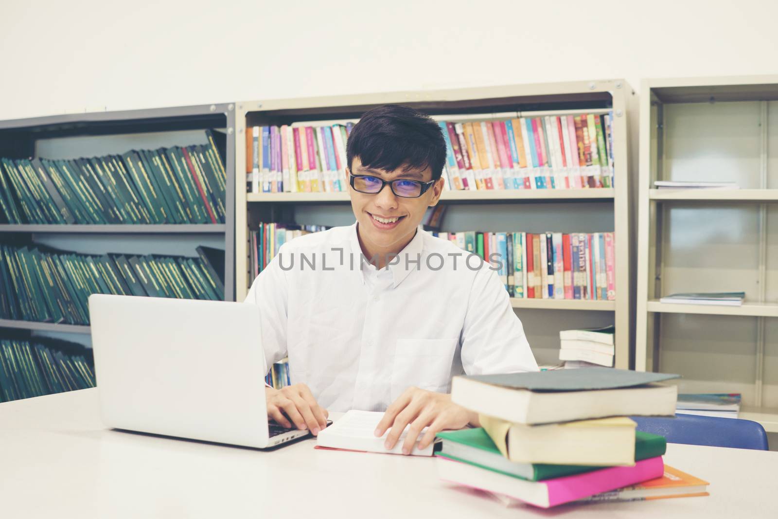 Student making research on laptop and browse internet. Education by Johnstocker