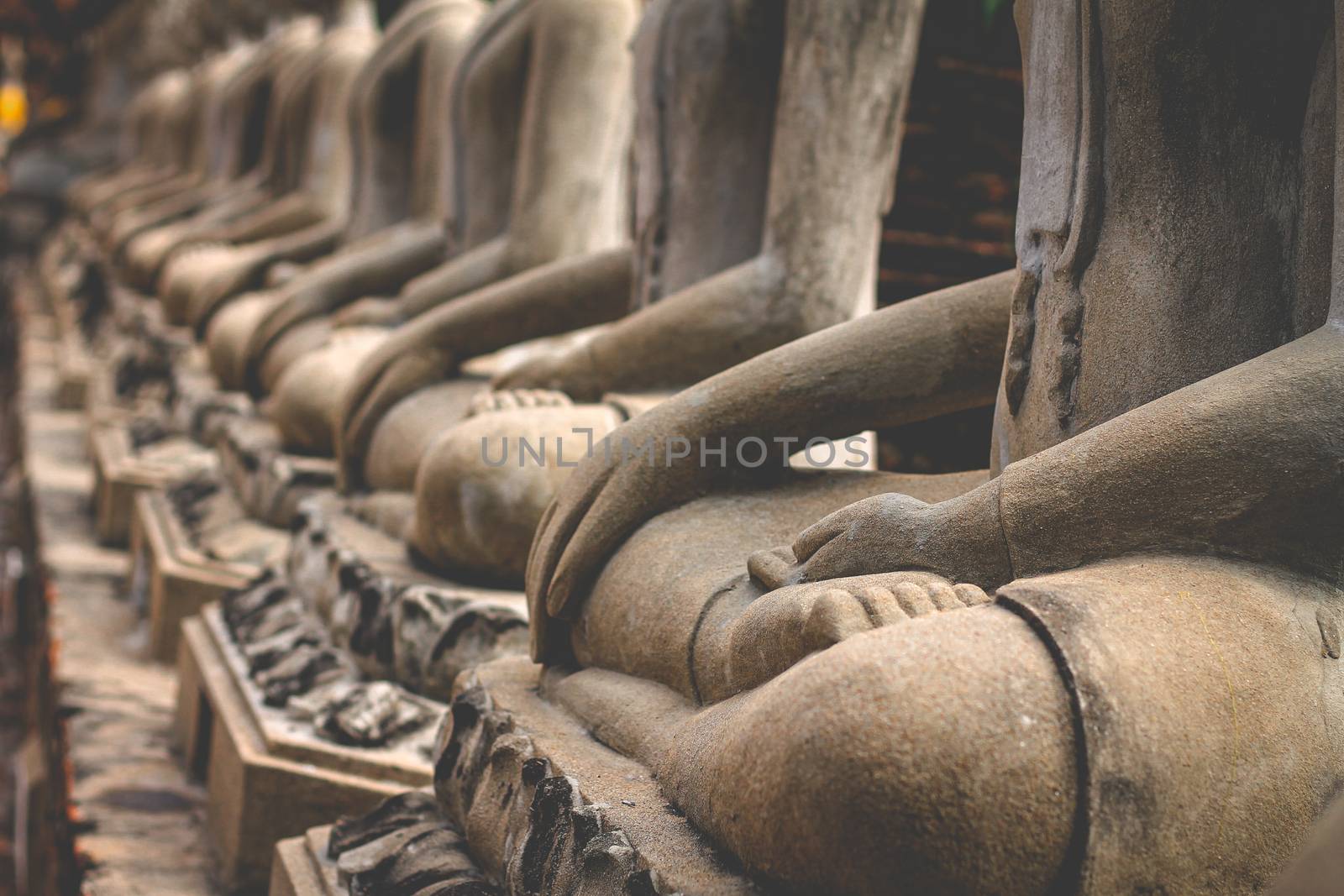 Cinematic photo of buddha statue hand in meditation pose to show the concept of harmony between mind and body, mindfulness and wellness