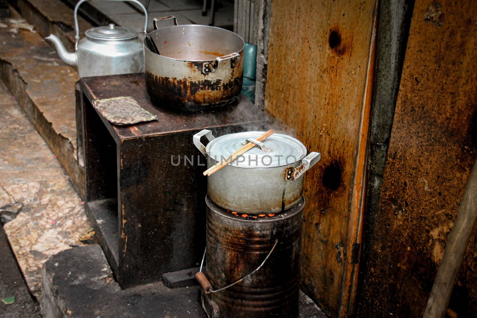 Rustic traditional street cooking in Old Quarter (French Quarter) in Hanoi, Vietnam