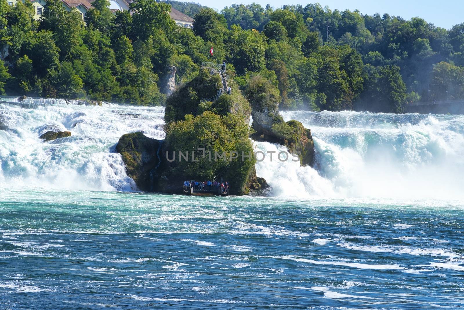 the famous rhine falls in the swiss near the city of Schaffhausen - sunny day and blue sky