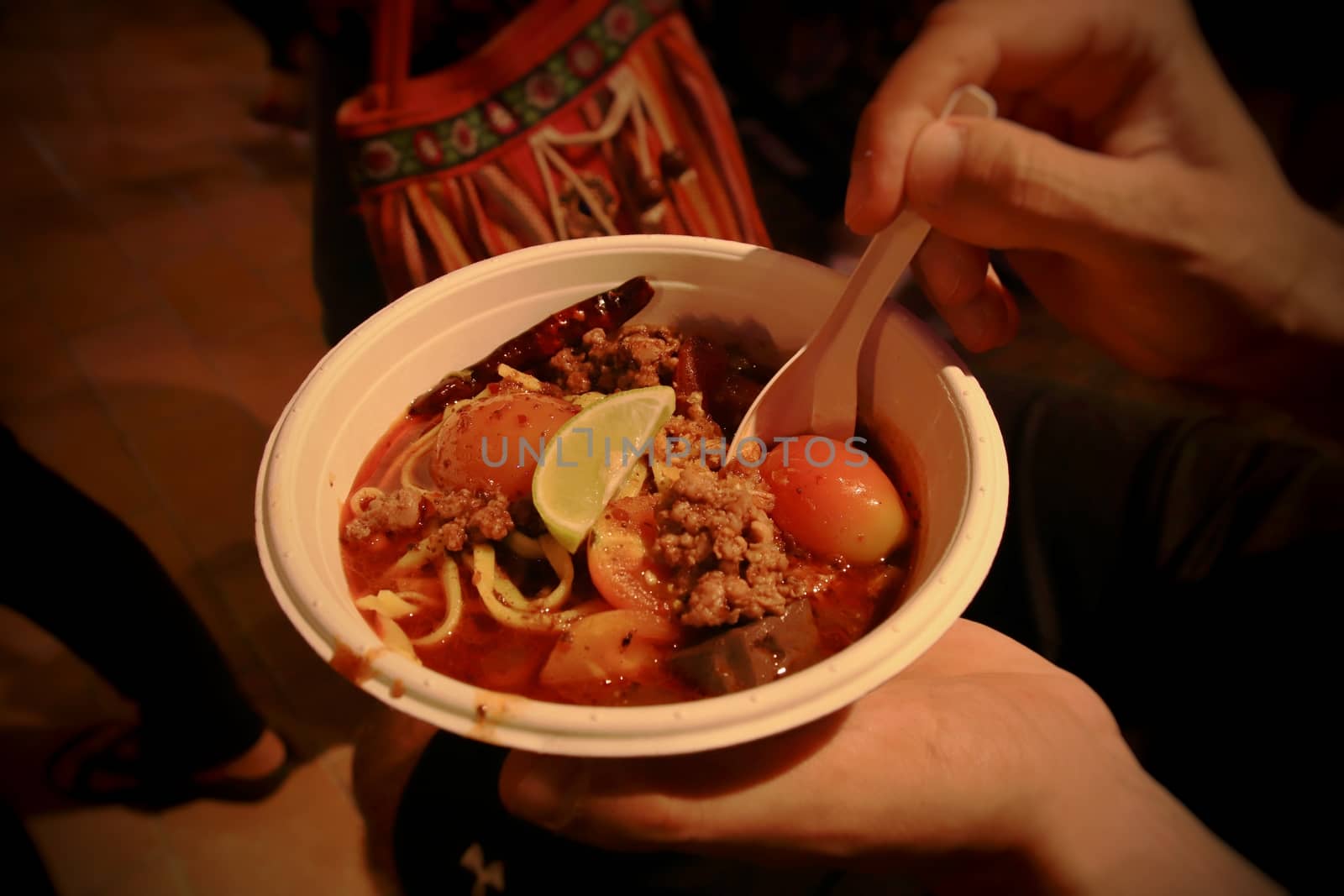 Laksa soup made from wheat noodles and spicy curry coconut milk, a popular dish in Peranakan or Malaysian cuisine
