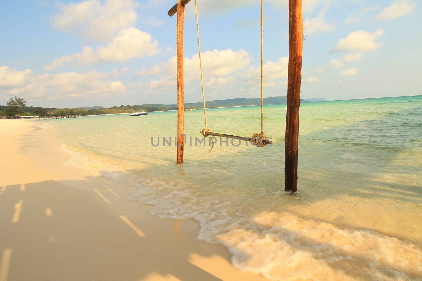 Makeshift swing on the shore of Sok San Beach in Koh Rong Island in Cambodia which is a famous tropical summer travel destination