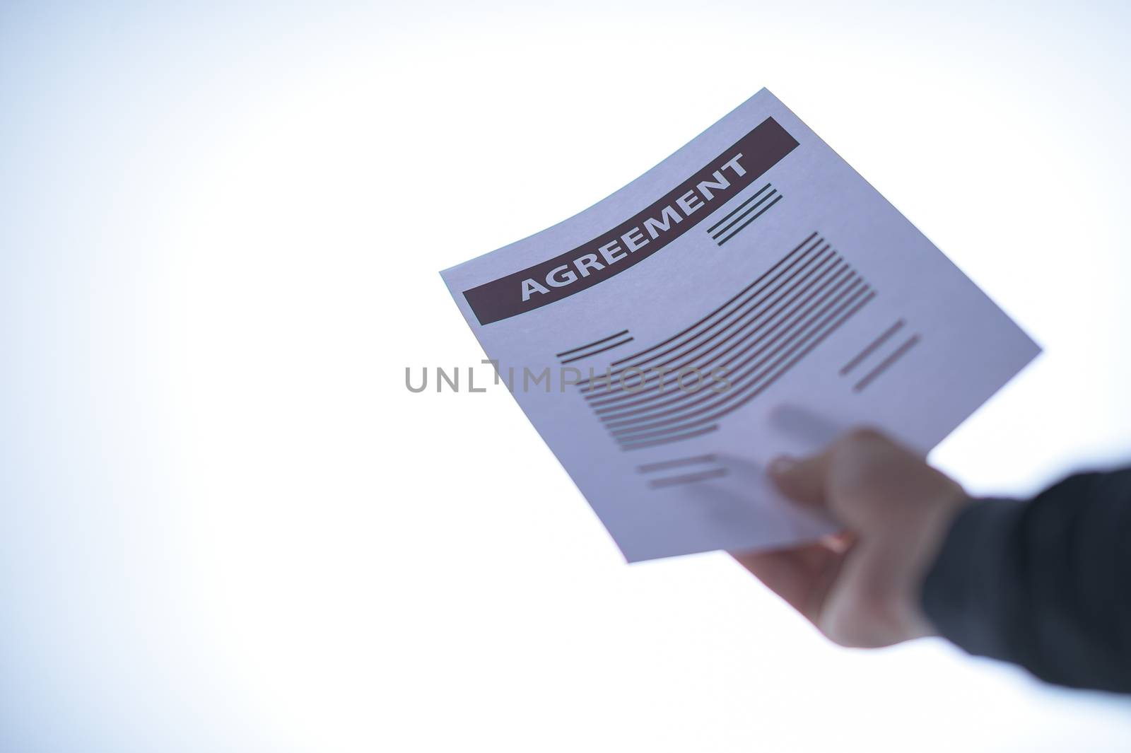 Businessman hand holding a document. Scenes white background. by Aukid