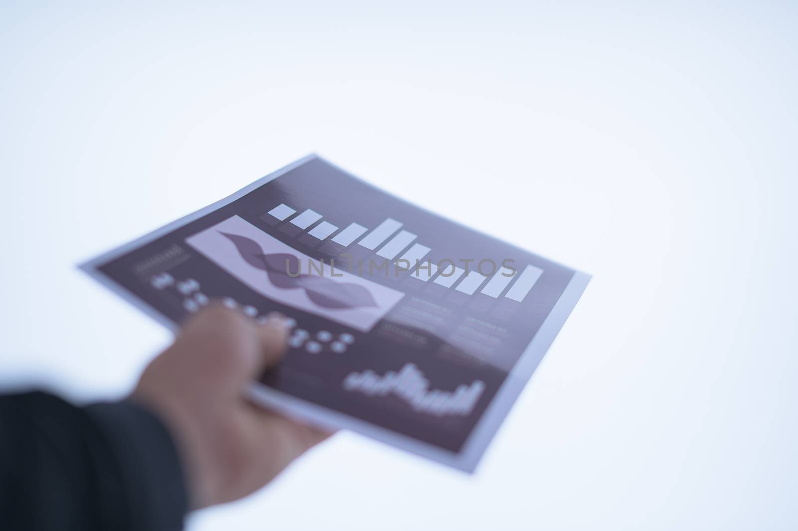 Businessman hand holding a document. Scenes white background.