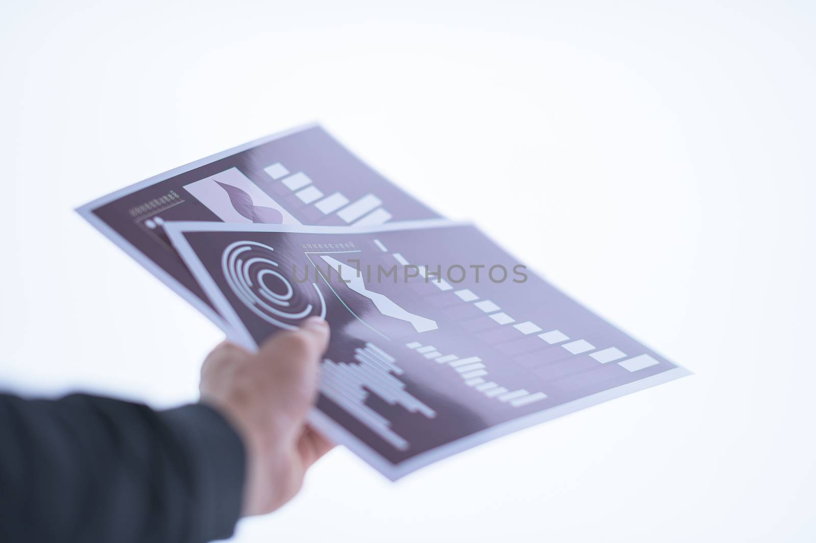 Businessman hand holding a document. Scenes white background. by Aukid