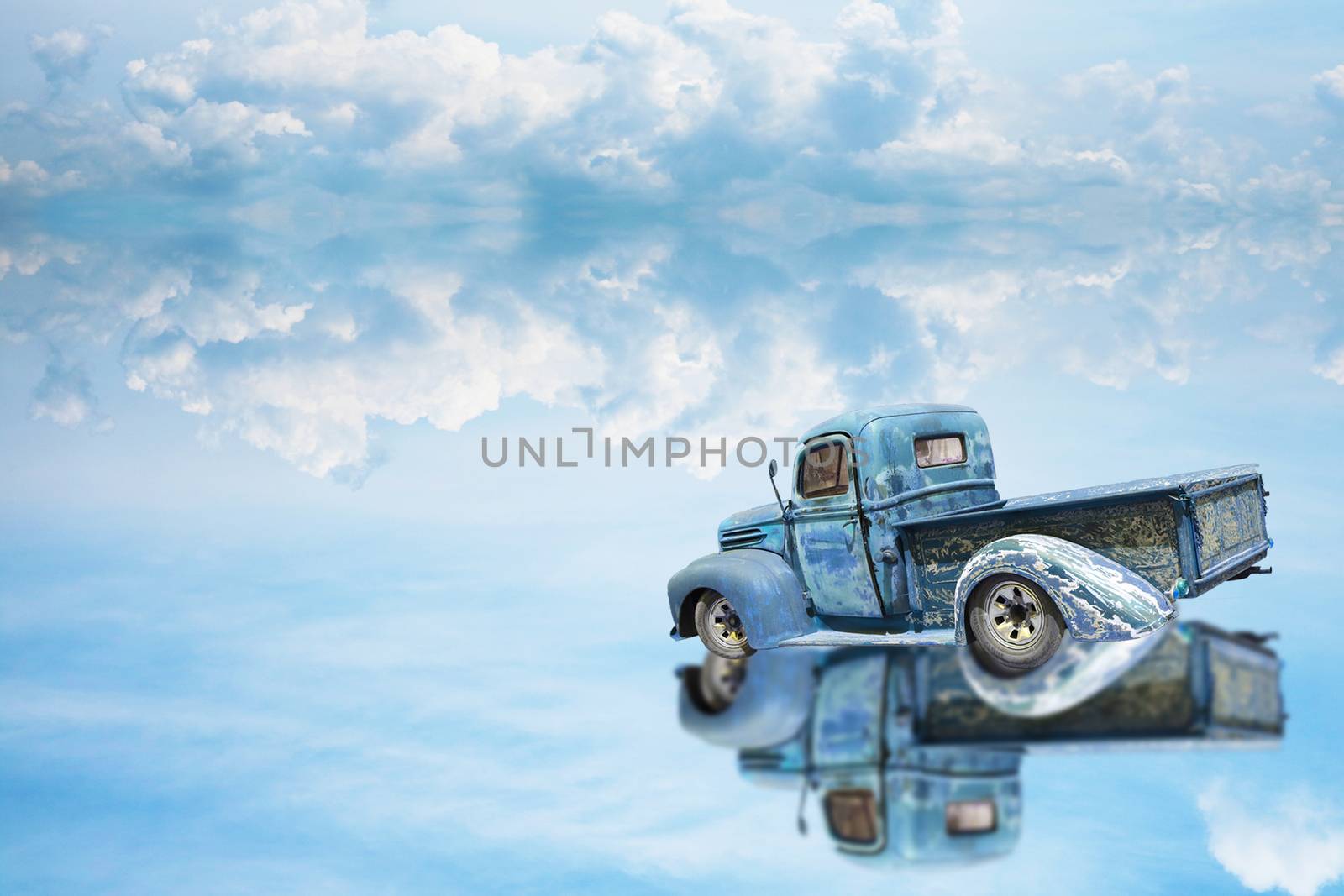 reflection car was parking on water on of lake and blue sky by Darkfox