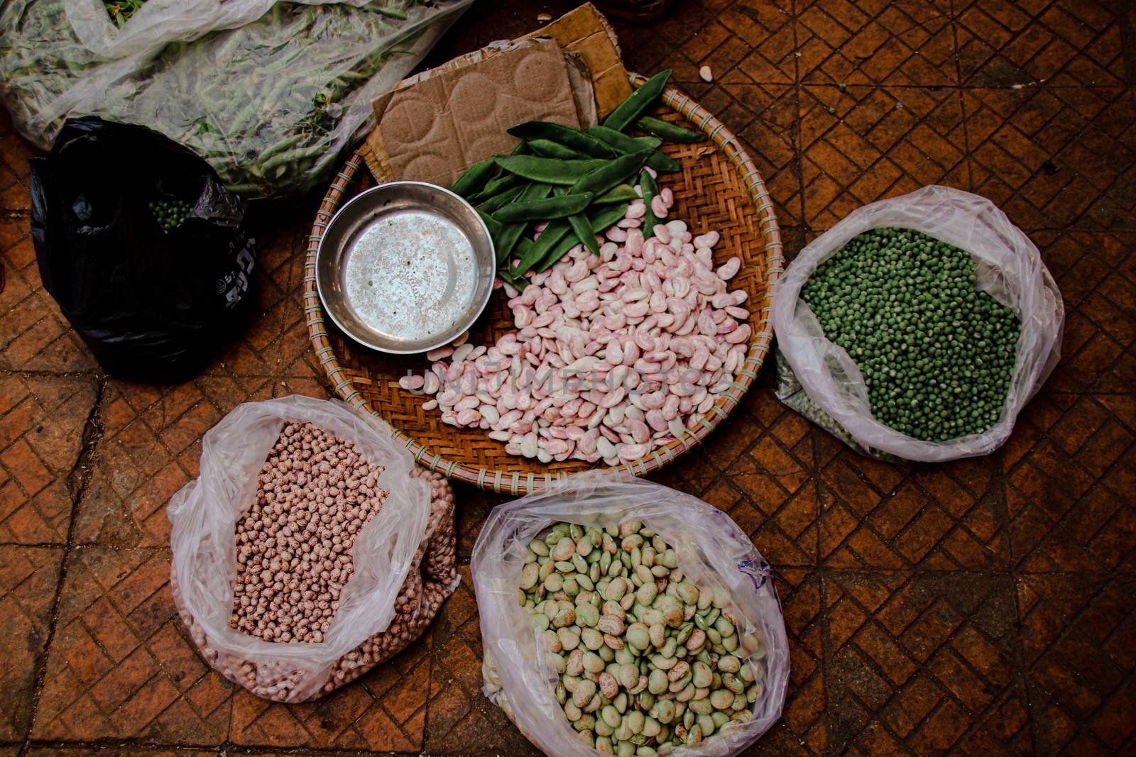 Beans and peas sold in the traditional local street market in Danang Vietnam that shows the authentic lifestyle and local culture of the country