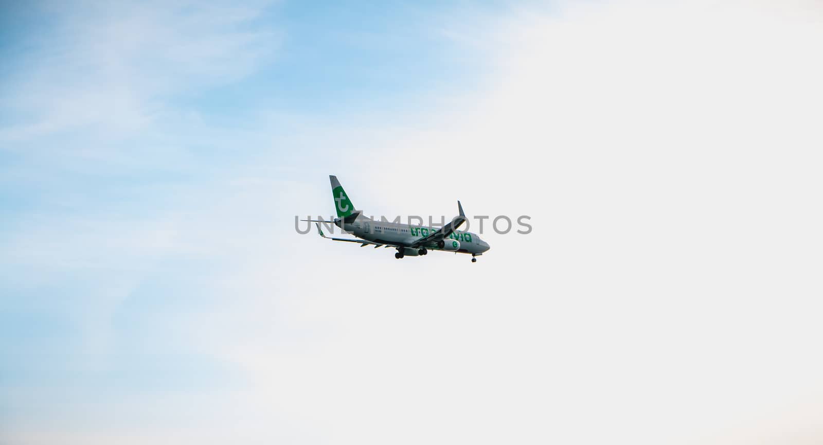 Faro, Portugal - May 1, 2018: plane Boeing 737-8K2 of the company Transavia on approach to Faro international airport on a spring day