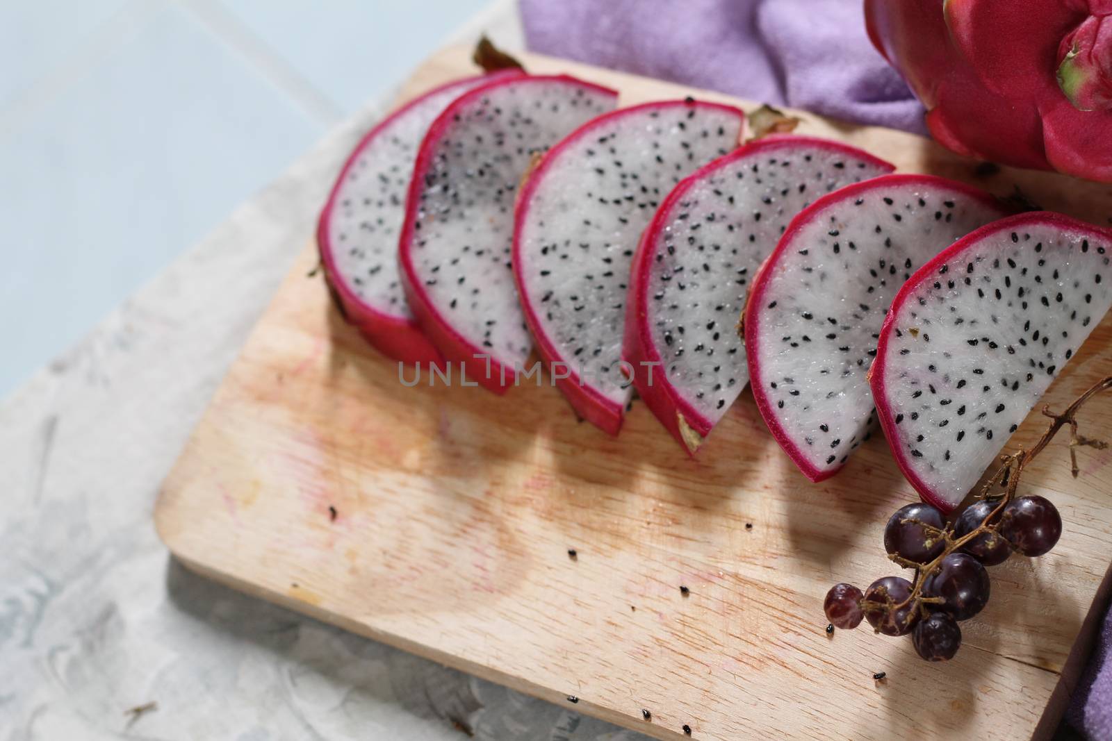 Sliced dragon fruit also known as Pitaya blanca or white-fleshed pitaya by Sonnet15