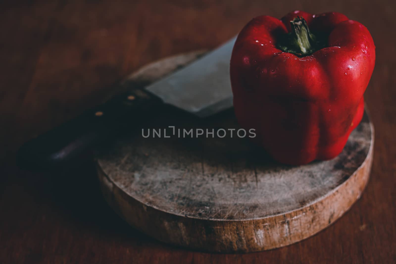 Red Bell Pepper shot in low light to show concept of gastronomy, clean living and healthy diet
