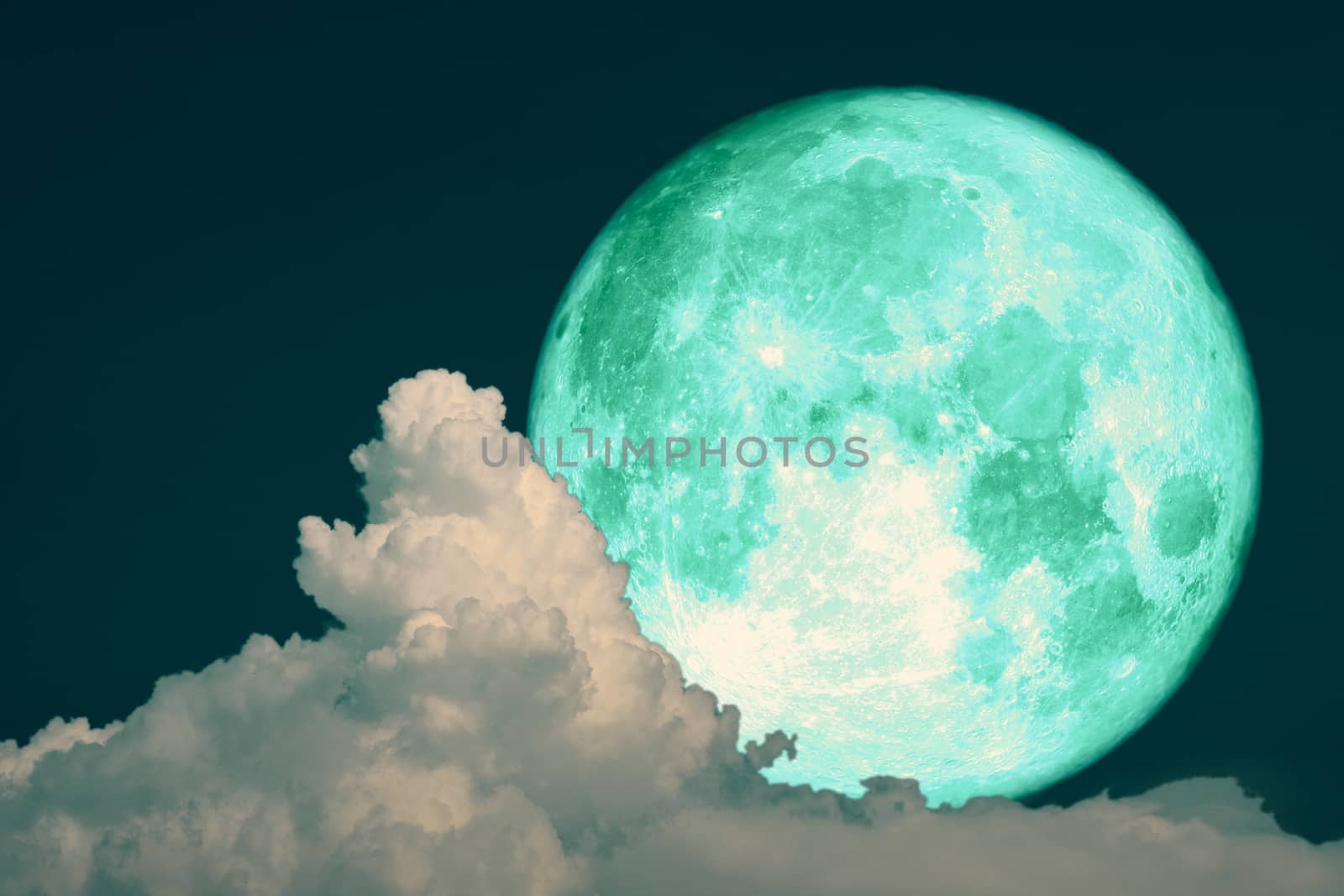 green strawberry moon back on silhouette heap cloud on night sky, Elements of this image furnished by NASA