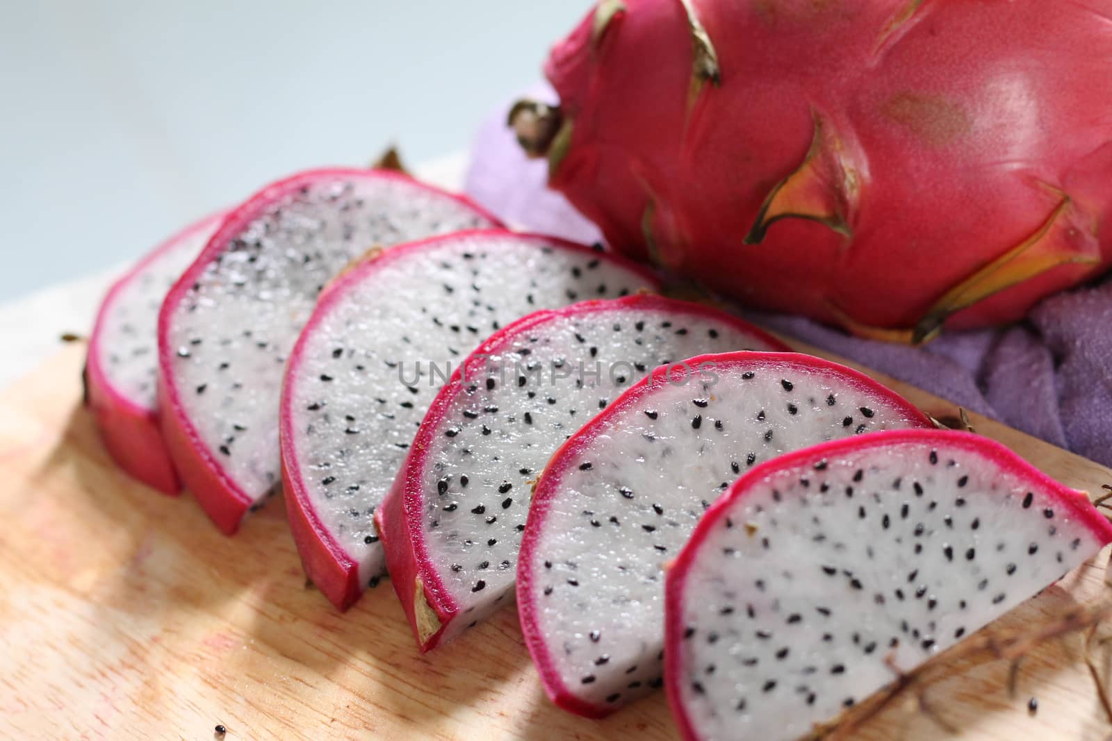 Sliced dragon fruit or Hylocereus undatus (Pitaya blanca or white-fleshed pitaya) as a simple and healthy vegan breakfast for staying healthy and fit during home quarantine due to covid-19 pandemic