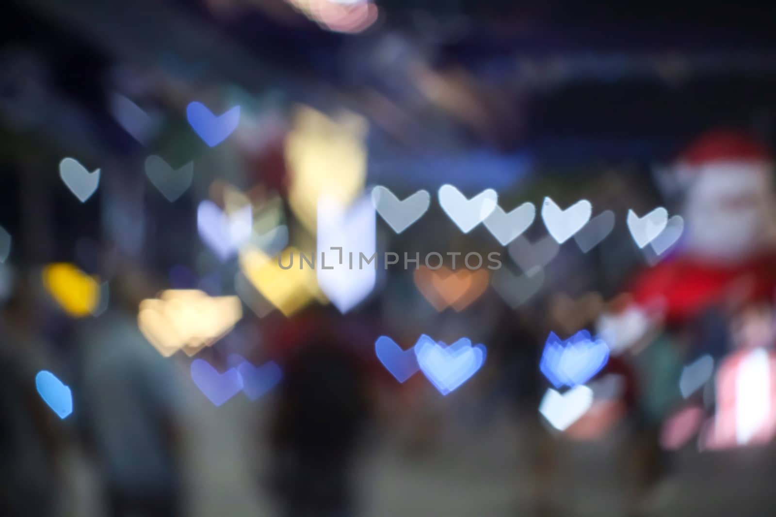 abstract blur and bokeh heart shape love valentine colorful night light of shopping mall