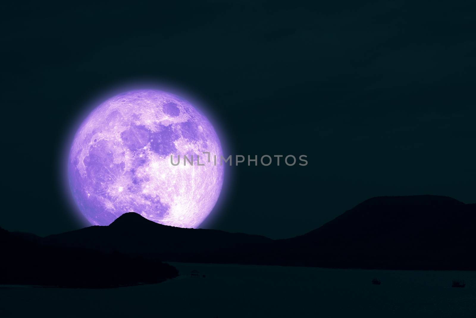 Full Snow Moon on night sky back silhouette island in the ocean night sky, Elements of this image furnished by NASA