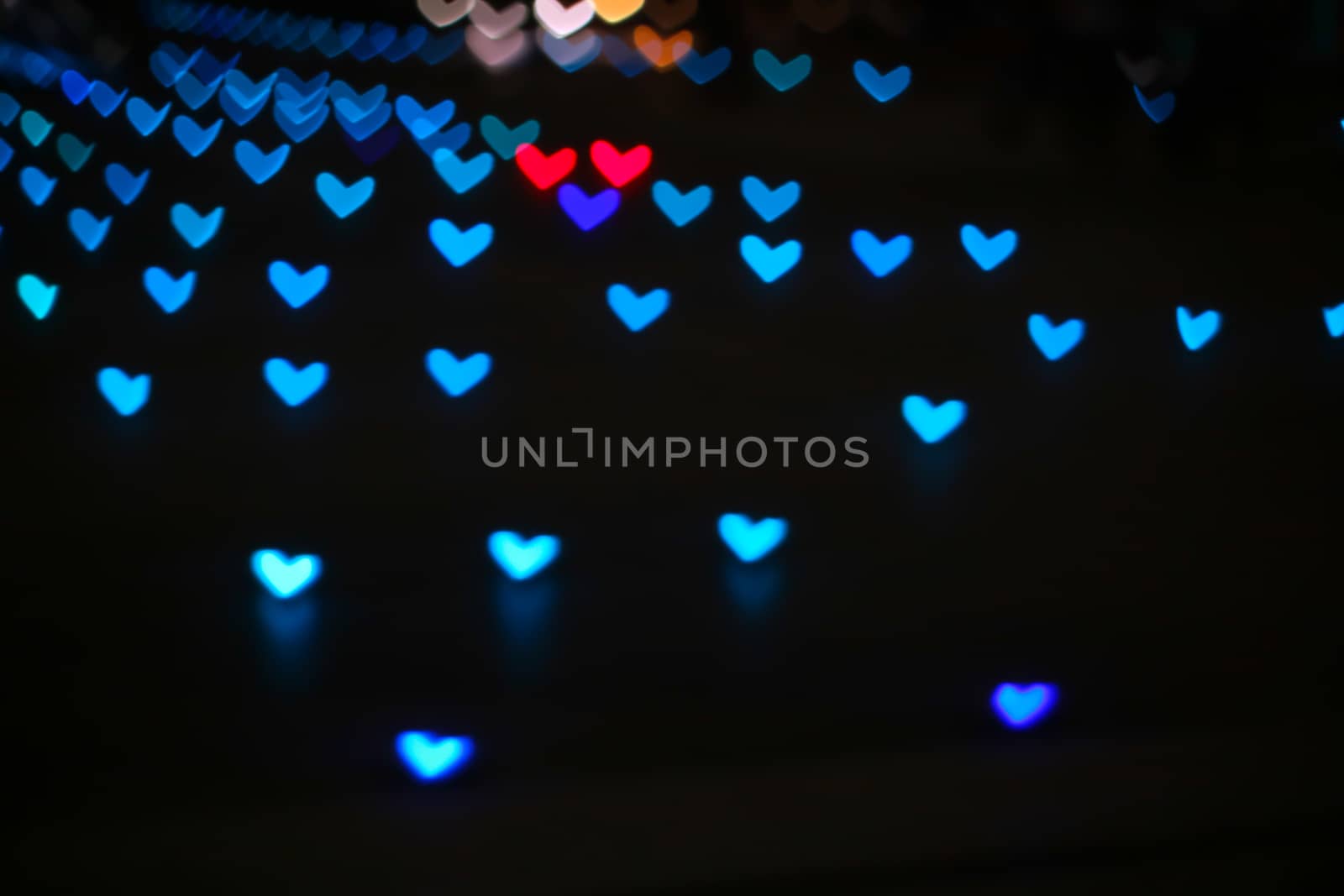 aqua colorful bokeh and blur heart shape love valentine day night light on floor