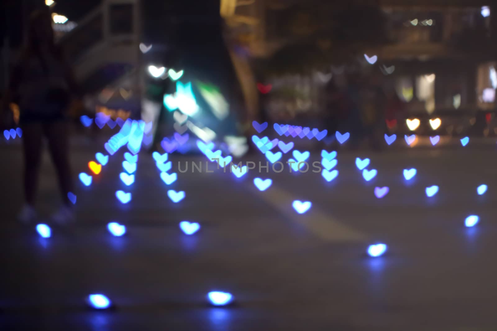 blue  bokeh and blur heart shape love valentine colorful night light on floor at shopping mall