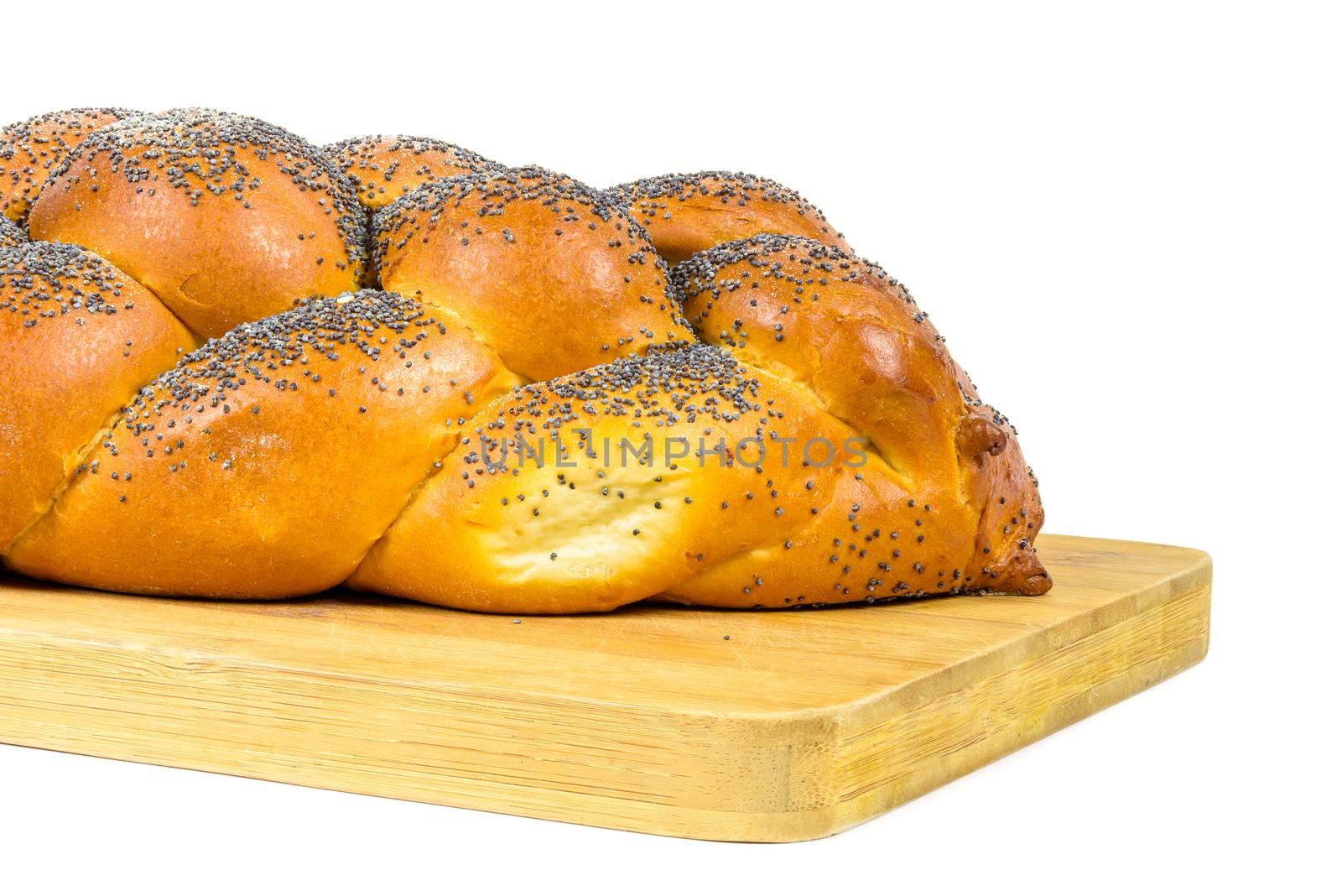 Closeup of challah bread on chopping board by mkos83