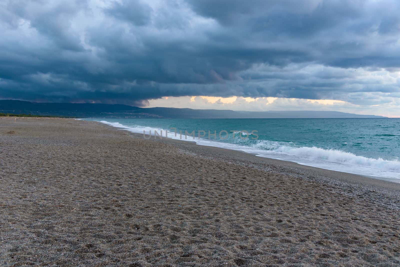 Dark clouds over the calabrian beach before the storm