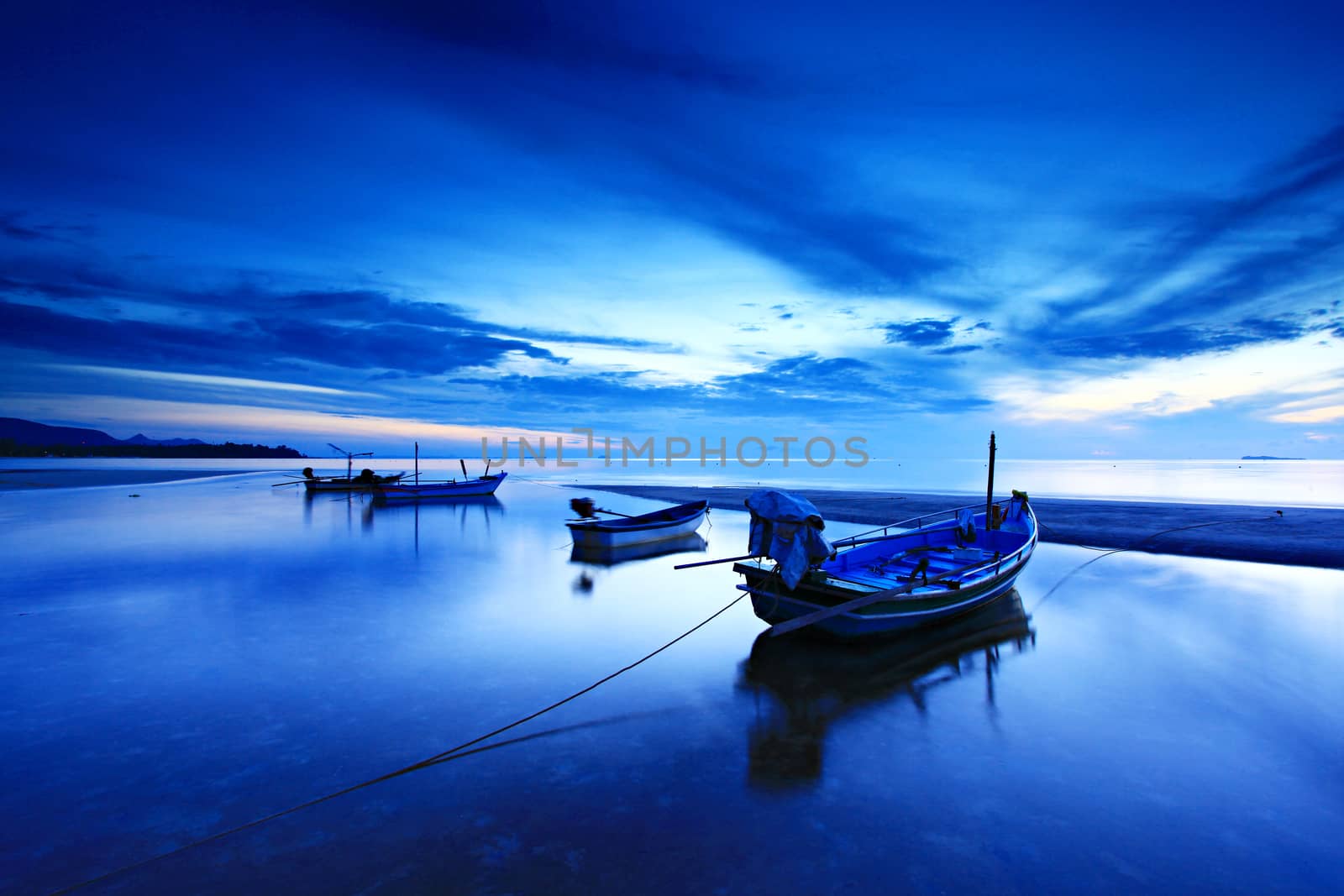 Fishing boats parked on the beach after the storm at thung wua laen beach, Saphli in Chumphon Province, Thailand