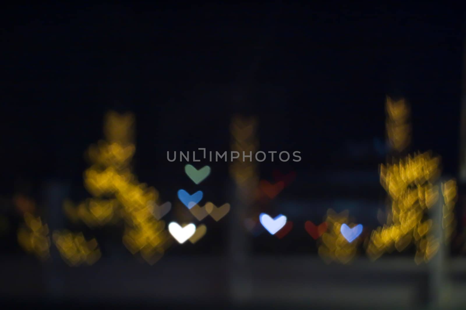 yellow bokeh and blur heart shape love valentine day colorful night light on street