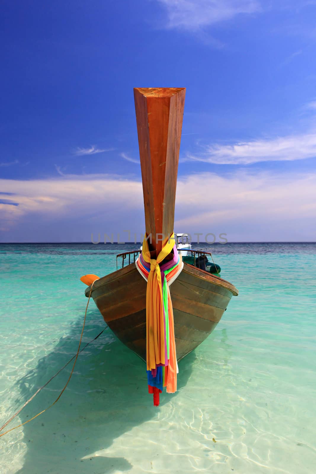 Traditional Thai long tail boat at Andaman sea famous sunny beach. Southern, Thailand