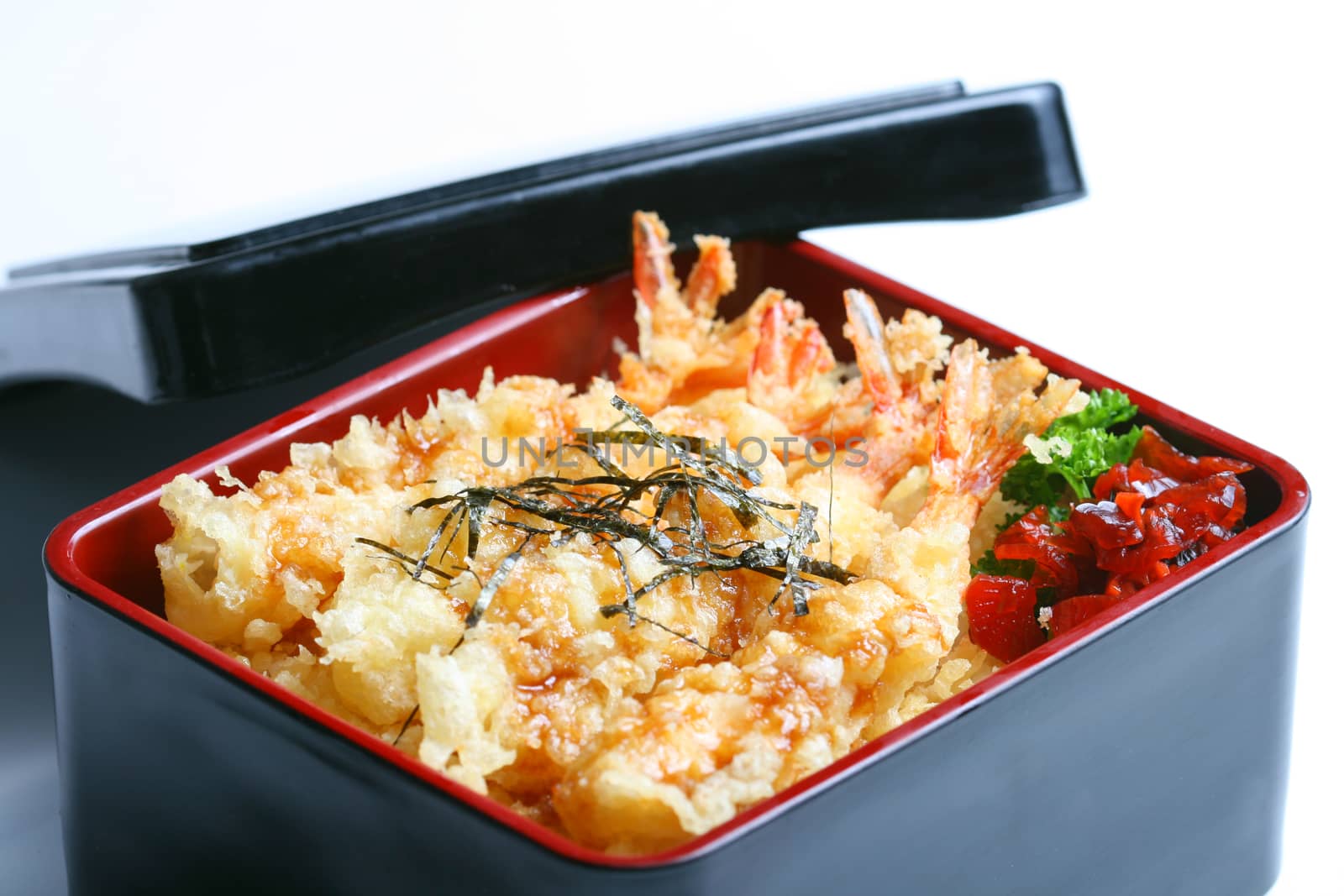 Ebi tempura don or Ebi Kakiage served with red pickled vegetables (Fukujin Zuke) in white background by Mercedess
