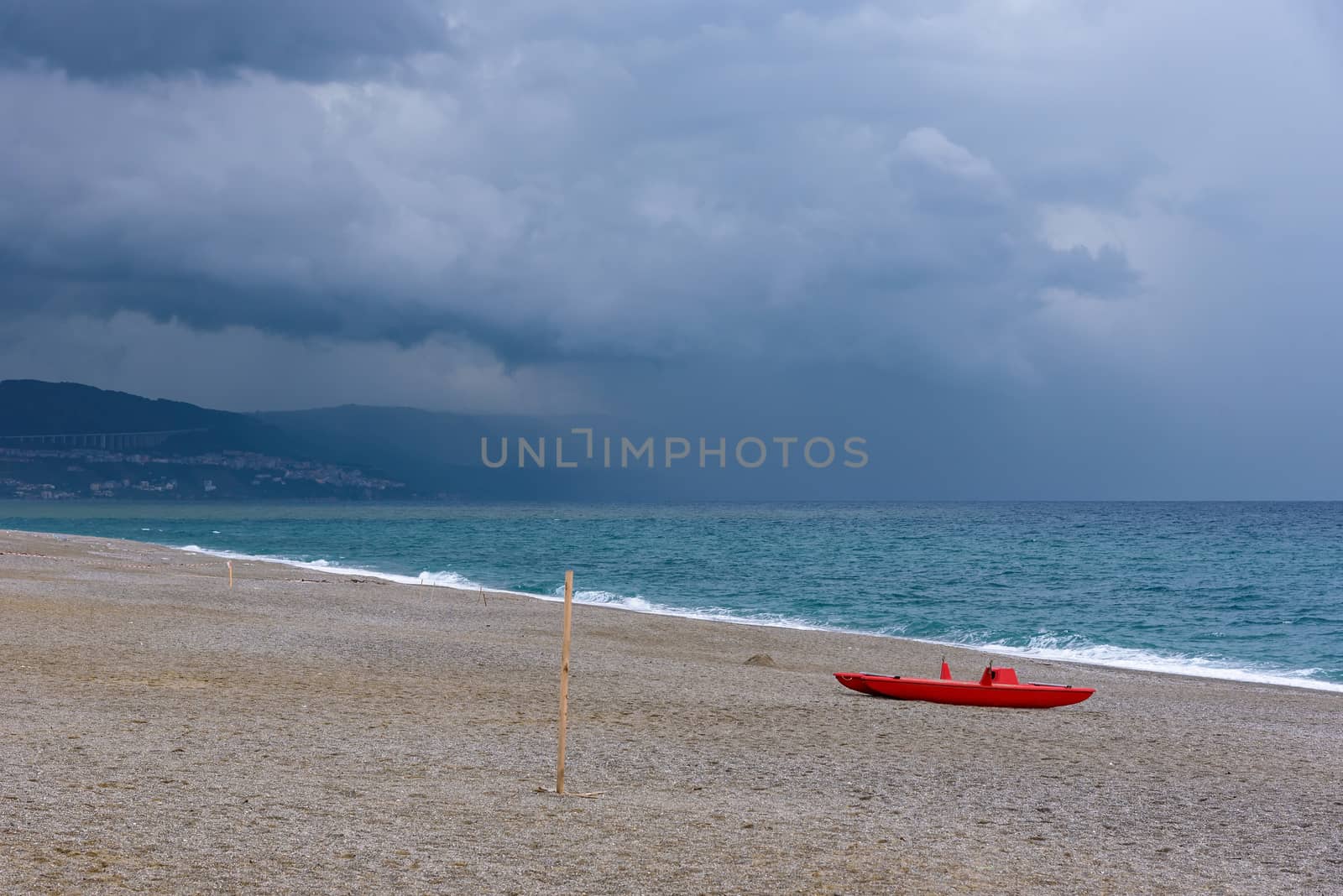 Dark clouds over the calabrian beach before the storm